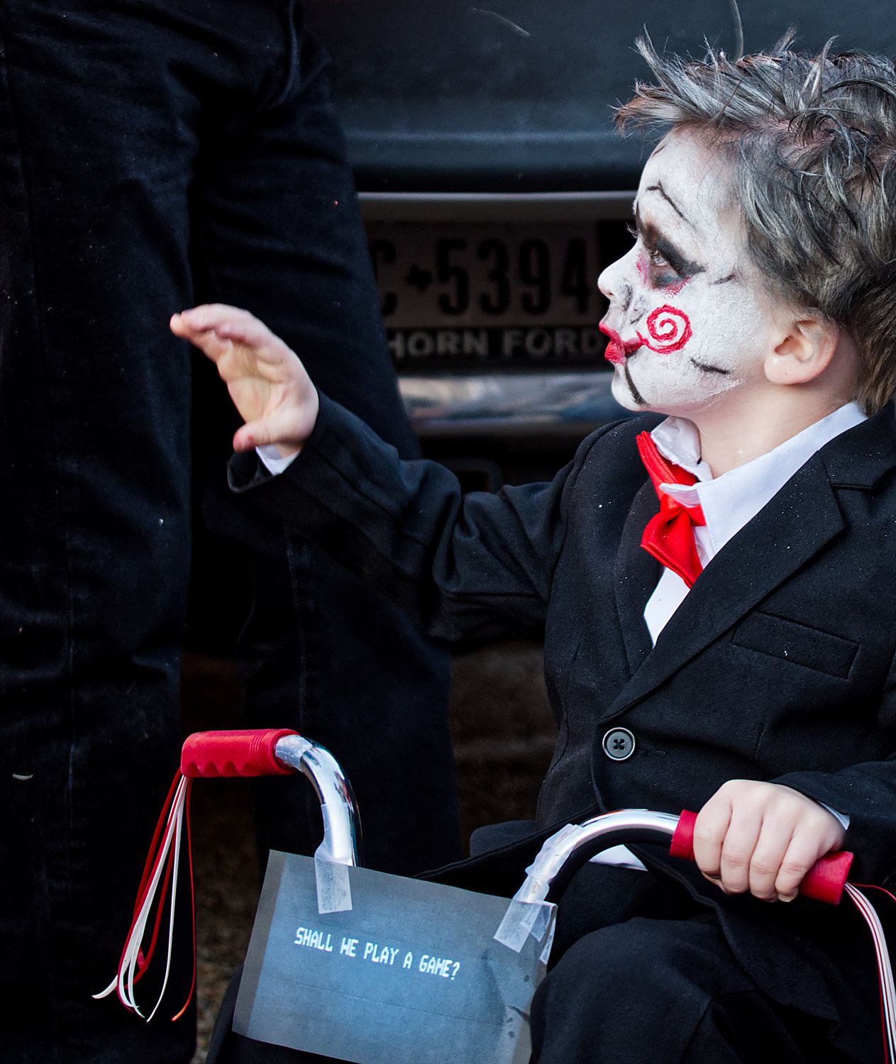Jigsaw makes his way through the trunk or treat in downtown Mineola on Halloween.